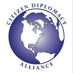 A blue globe with the words citizen diplomacy alliance underneath it.